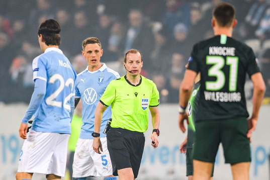 Sören Rieks of Malmö FF and referee William Sean Collum