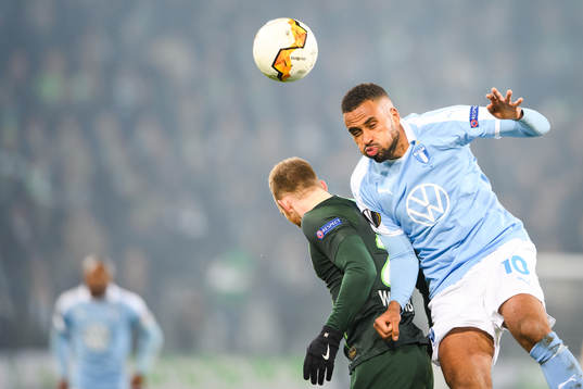 Isaac Kiese Thelin of Malmö FF and John Brooks of Wolfsburg