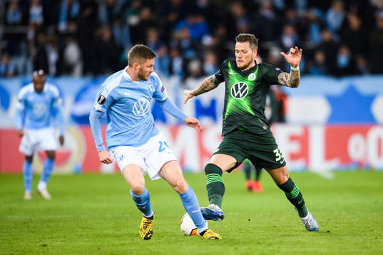 Daniel Ginczek of Wolfsburg and Lasse Nielsen of Malmö FF
