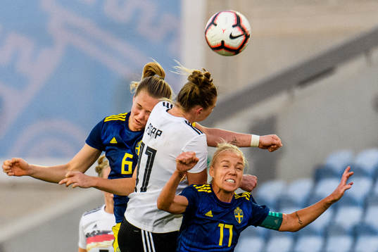 Magdalena Eriksson and Caroline Seger of Sweden fights for