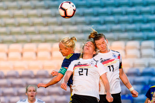 Caroline Seger of Sweden fights for the ball with Lena