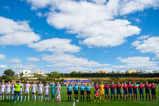 Players of Denmark and of Norway line up