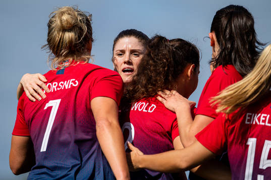 Elise Thorsnes of Norway celebrates with Maren Mjelde and