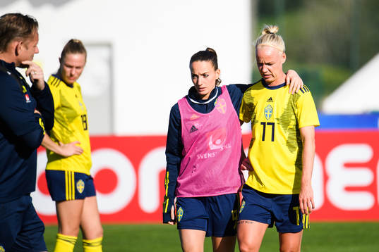 Kosovare Asllani and Caroline Seger of Sweden look dejected
