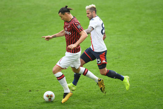 Zlatan Ibrahimovic of Milan and Valon Behrami of Genoa