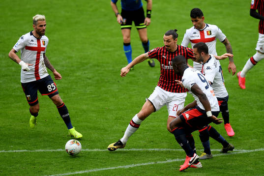 Zlatan Ibrahimovic of Milan and Antonio Biraschi of Genoa