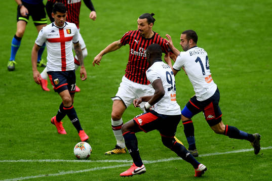 Zlatan Ibrahimovic of Milan and Antonio Biraschi of Genoa