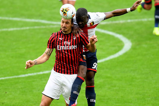 Zlatan Ibrahimovic of Milan and Adama Soumaoro of Genoa