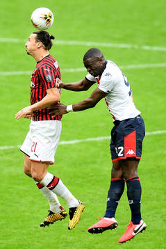 Zlatan Ibrahimovic of Milan and Adama Soumaoro of Genoa