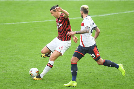 Zlatan Ibrahimovic of Milan and Valon Behrami of Genoa