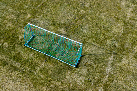 General view of an empty football pitch as the Coronavirus,