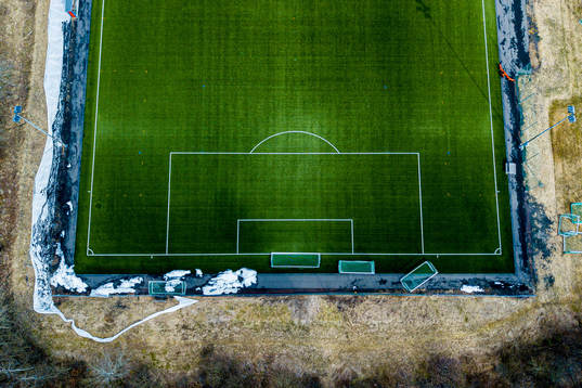 General view of an empty football pitch as the Coronavirus,