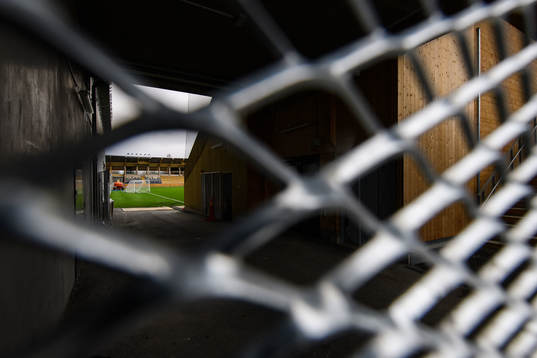 The pitch of Studenternas IP is seen through a fence as the