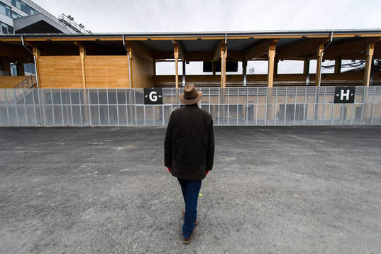 A man poses for a photo outside Studenternas IP as the