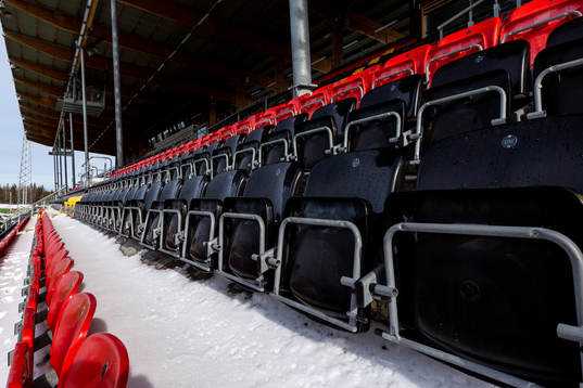 Spectator seats in snow at Jämtkraft Arena as the