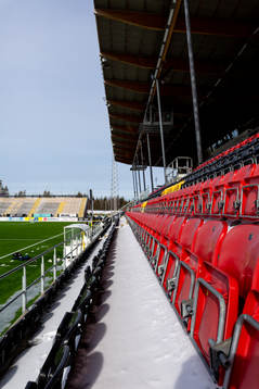 Spectator seats in snow at Jämtkraft Arena as the