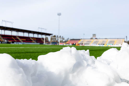 Snow piled up in front of the pitch at Jämtkraft Arena as