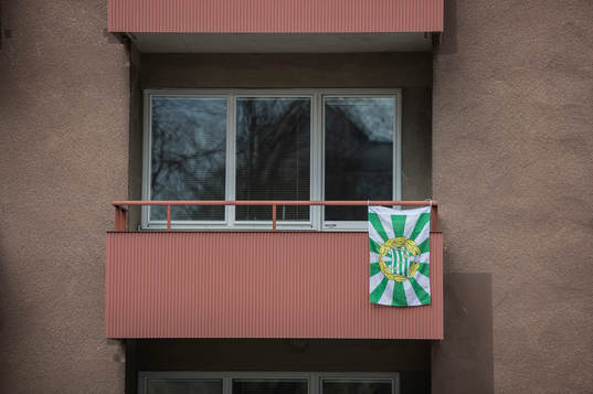 A balcony near Tele2 Arena is decorated with a flag to show