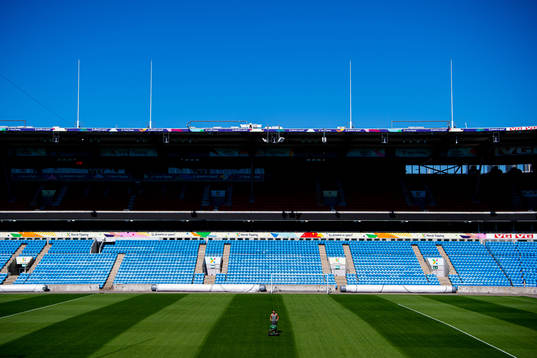 A groundsman maintains the pitch