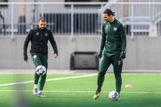 Abdul Khalili and Zlatan Ibrahimovic participate in a