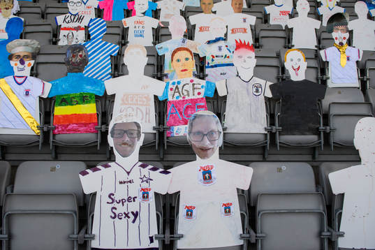 Paper dolls in the stands