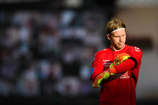 Goalkeeper William Eskelinen of Aarhus looks dejected