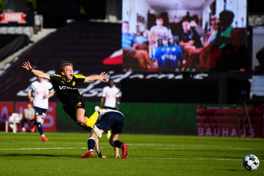 Mathias Greve of Randers in action infront of a virtual