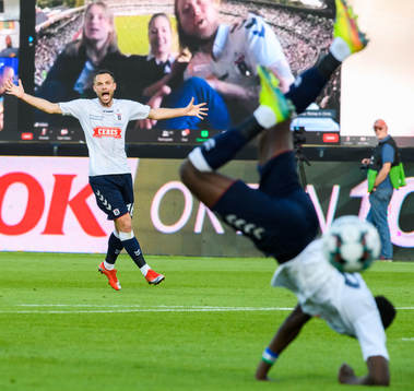 Casper Höjer Nielsen reacts as Mustapha Bundu of Aarhus