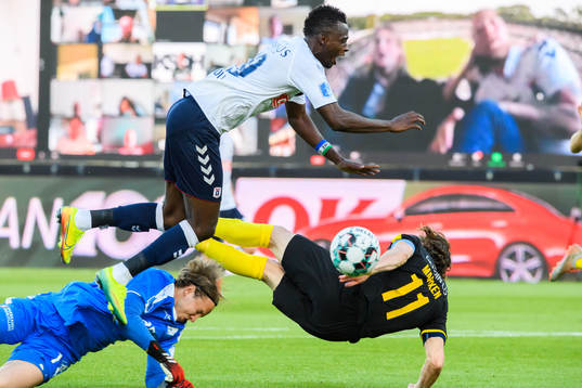 Mustapha Bundu of Aarhus in action with goalkeeper Patrik