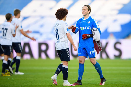 Goalkeeper Patrik Carlgren of Randers and Mustafa Amini of