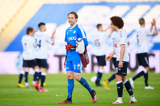 Goalkeeper Patrik Carlgren of Randers and Mustafa Amini of