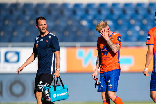 Fredrik Kjernmoen Carlsen of Aalesund leaves the pitch with
