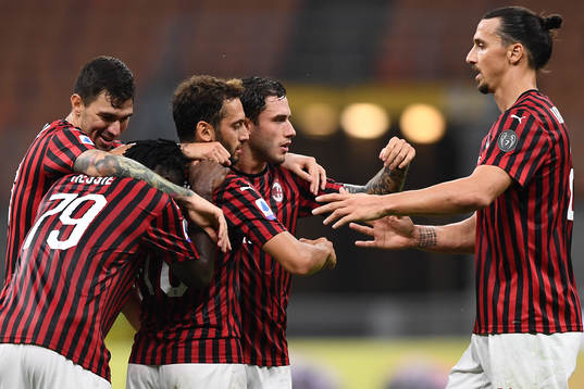 Zlatan Ibrahimovic of AC Milan celebrates with teammates