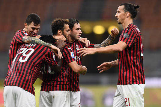 Zlatan Ibrahimovic of AC Milan celebrates with teammates
