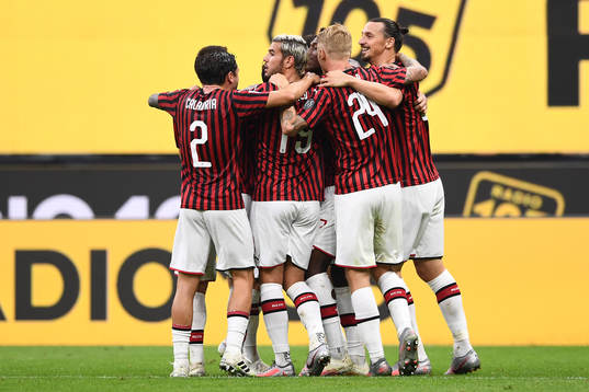 Zlatan Ibrahimovic of AC Milan celebrates with teammates