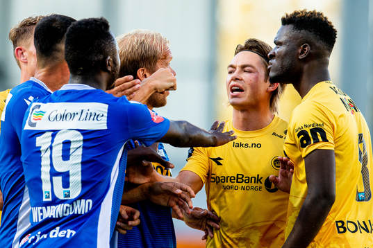 Brice Wembangomo and Lars Grorud of Sandefjord argue with