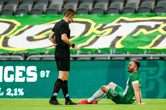 Referee Mario Zebec and Muamer Tankovic of Hammarby