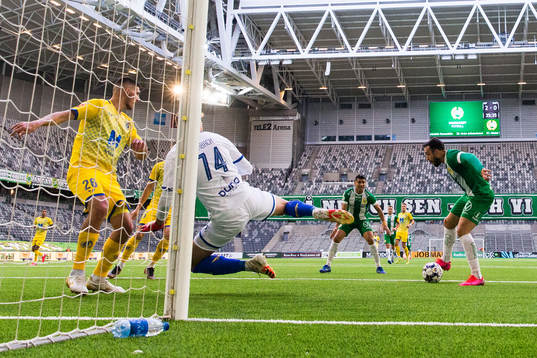 Abdul Khalili of Hammarby challenges goalkeeper Martin
