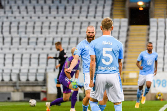 Jo Inge Berget celebrates with Sören Rieks of Malmö FF