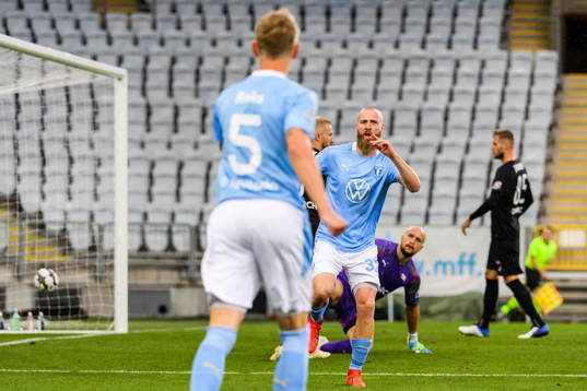 Jo Inge Berget celebrates with Sören Rieks of Malmö FF