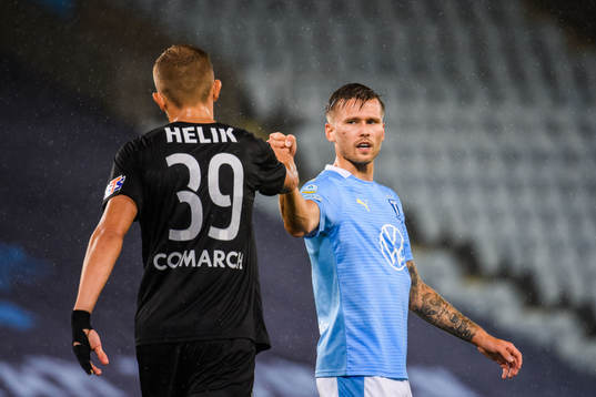 Michal Helik of Cracovia thank Arnór Traustason of Malmö