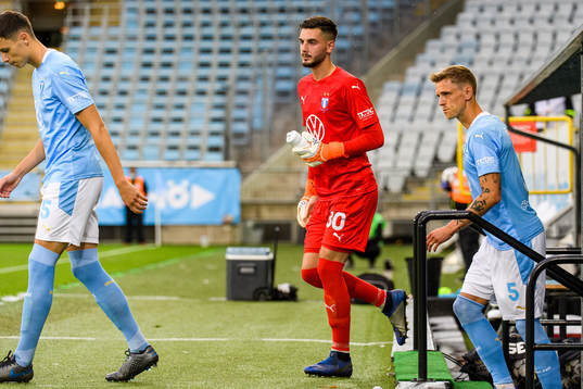 Goalkeeper Marko Johansson enters the pitch