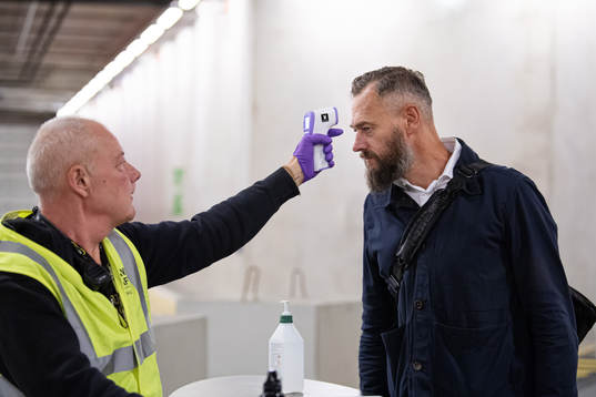 Swedish journalist Olof Lundh has his temperature checked