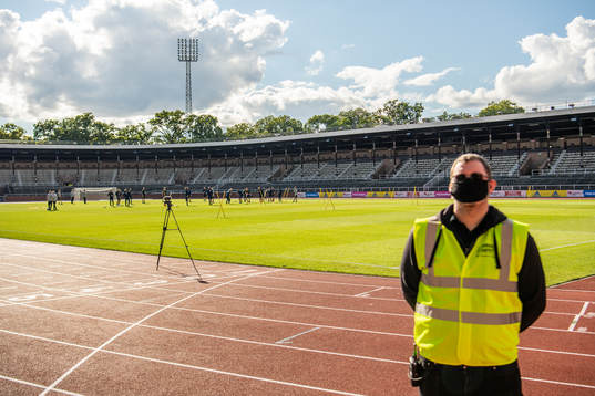 A security guard with a face mask