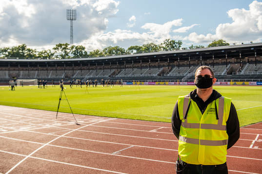 A security guard with a face mask