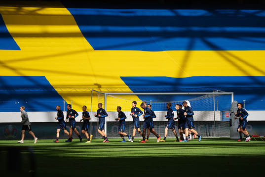 Players of the Swedish national football team warming up