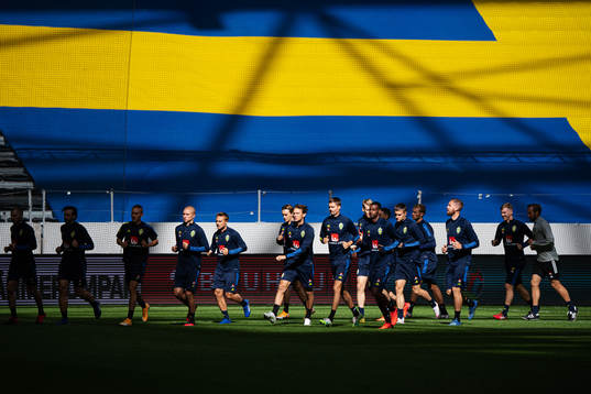 Players of the Swedish national football team warming up