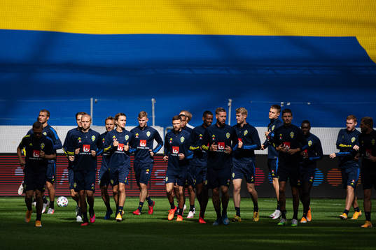 Players of the Swedish national football team warming up