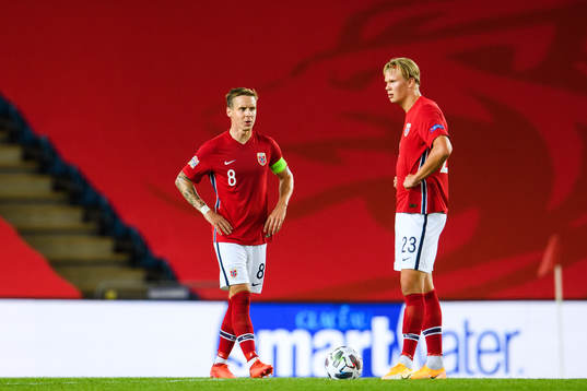 Stefan Johansen and Erling Braut Haaland of Norway look
