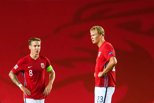 Stefan Johansen and Erling Braut Haaland of Norway look